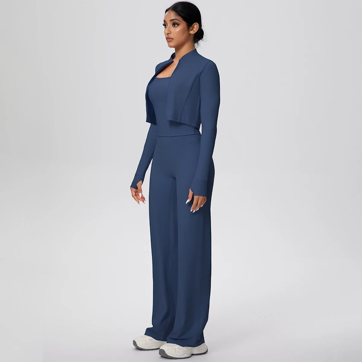 COMFORT Women's navy blue three-piece athletic set with cropped jacket, scoop neck bra, and wide-leg pants.