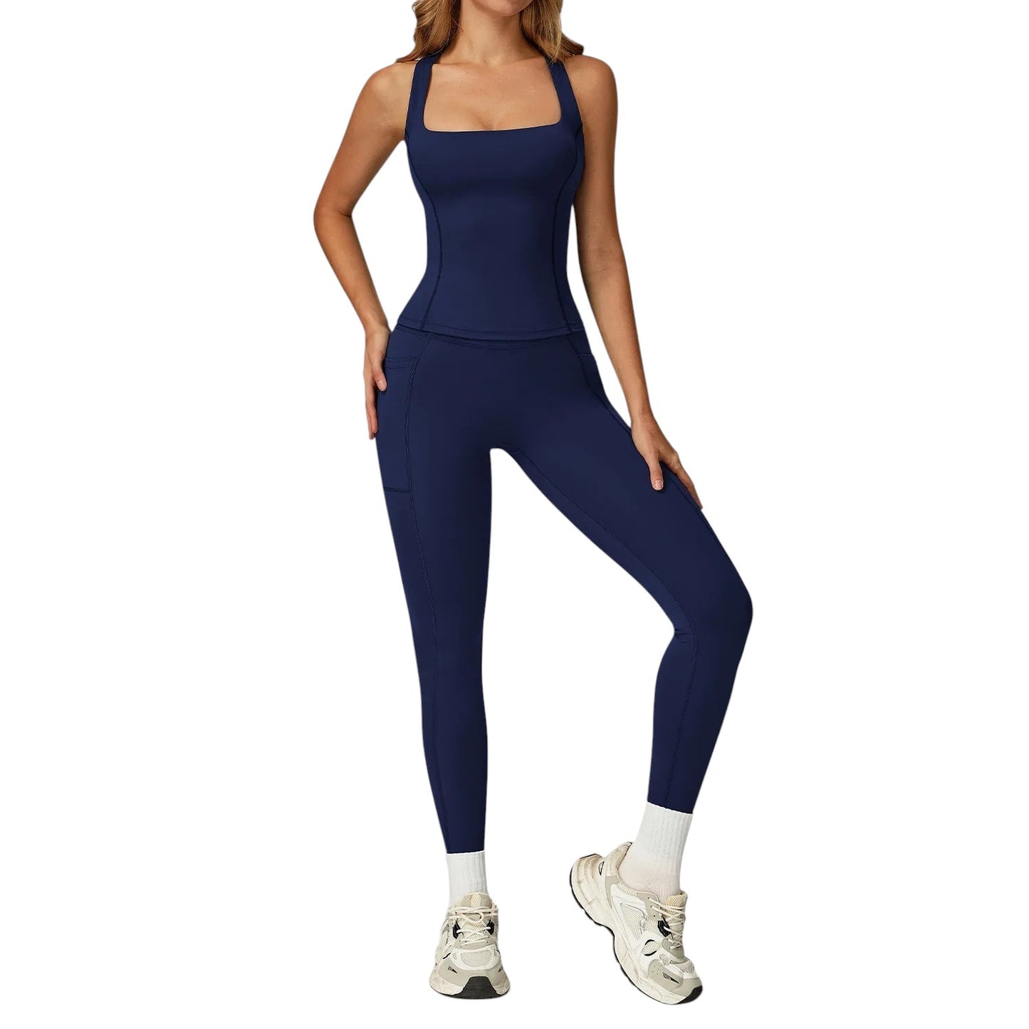 COMFORTH Women's navy blue athletic two-piece set with sports bra and flare leggings. V-neckline, V-waistband, side pockets.