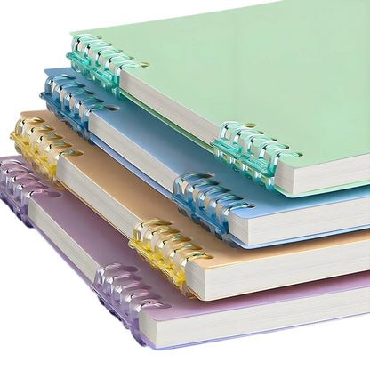 COMFORT pastel spiral bound notebooks in blush pink, sky blue, gentle yellow, lavender, and mint green with clear plastic binding.