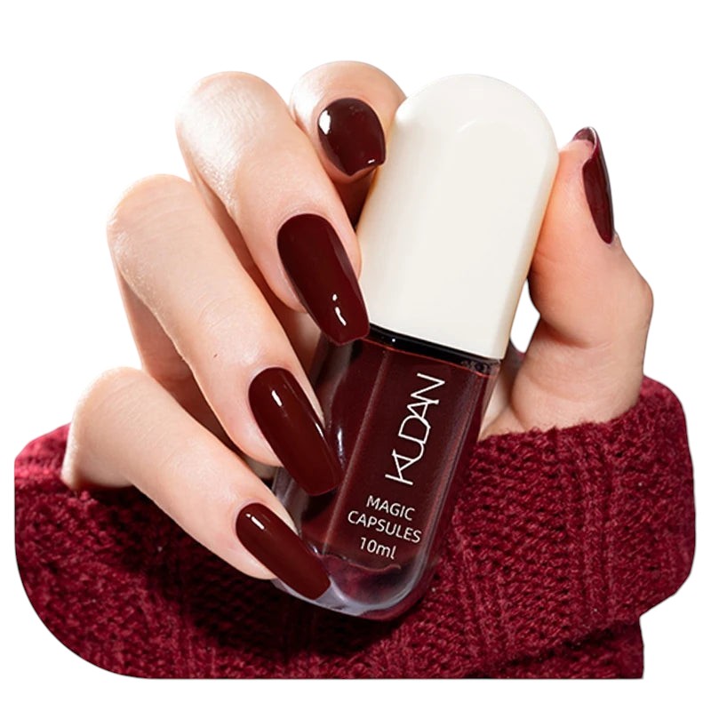 COMFORTH water-based peel off nail polish in deep burgundy, 10ml bottle held by a hand with matching nails.