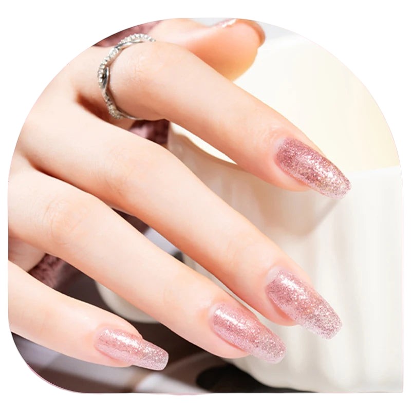 COMFORTH 40-color water-based peel-off nail polish collection, featuring a shimmering rose gold glitter shade on long, elegant nails.