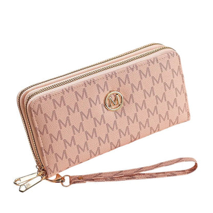 COMFORTH pink faux leather wristlet wallet with all-over monogram pattern and gold emblem. Features double zip compartments and card slots.