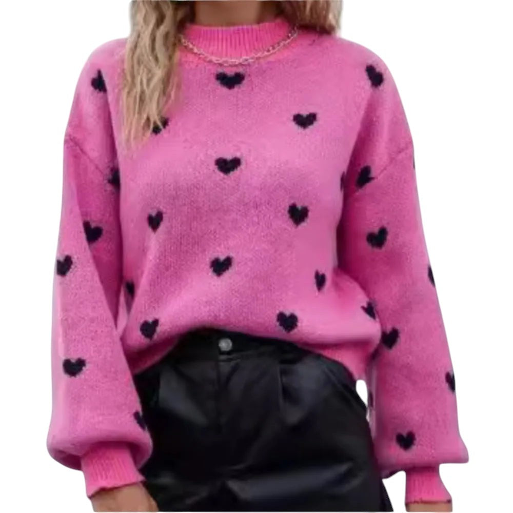 COMFORTH pink knit sweater with black heart pattern, long sleeves, crew neck, and ribbed cuffs and hem.