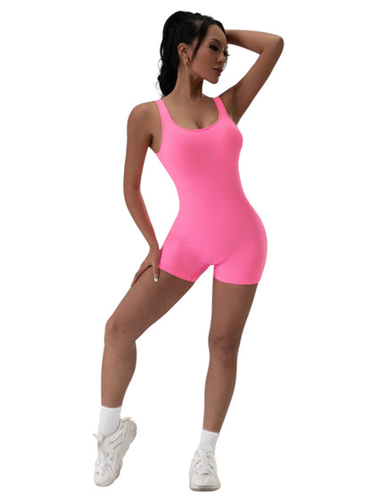 COMFORT women's bright pink ribbed athletic bodysuit short with scoop neck and racerback. Stretchy fabric.
