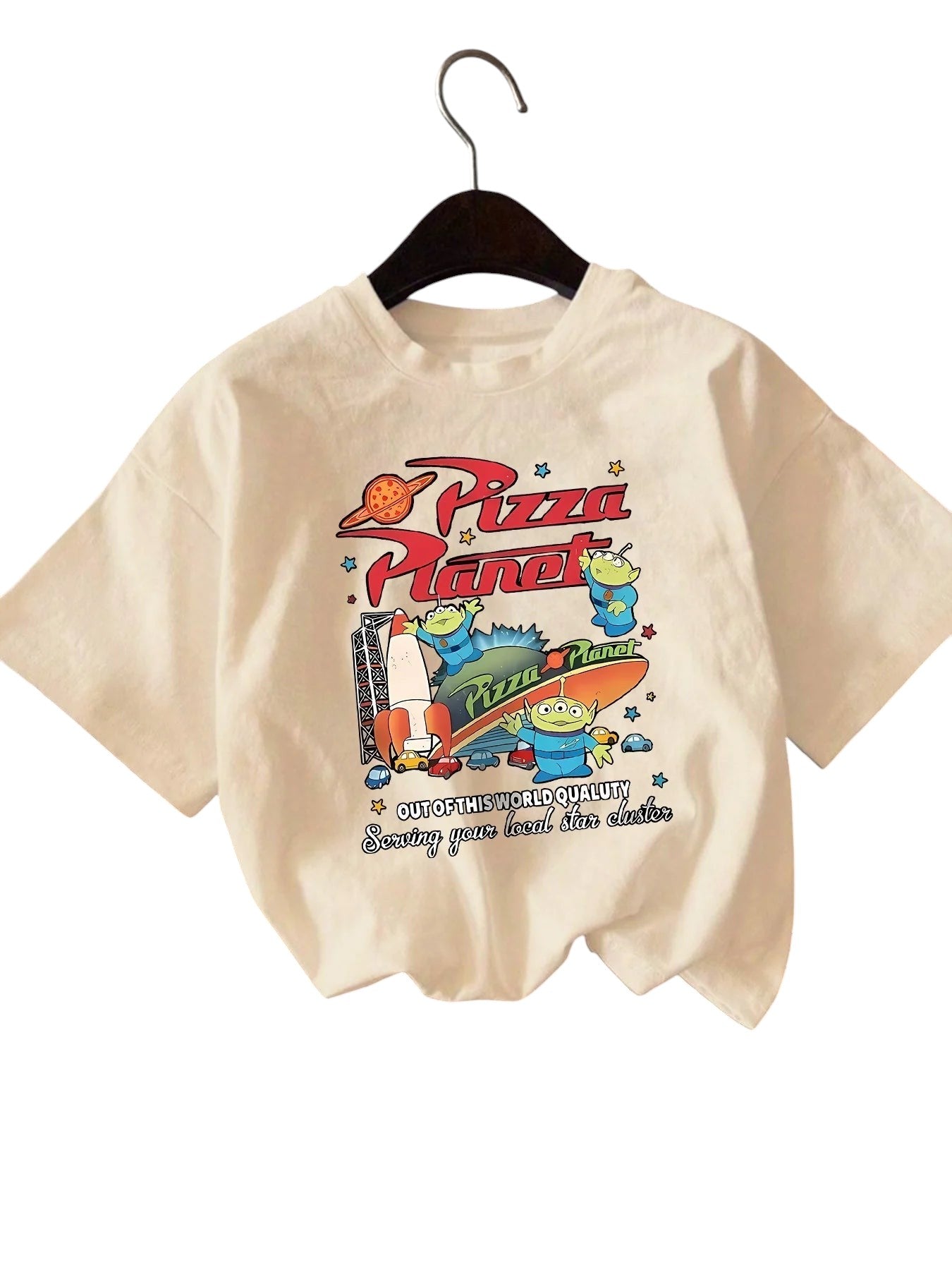 COMFORTH cream cotton short sleeve t-shirt with "Pizza Planet" graphic featuring aliens and rocket.