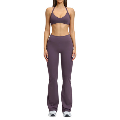 COMFORTHigh-waisted plum flare yoga pants with a comfortable, stretchy fabric blend. Model is wearing a matching plum sports bra.