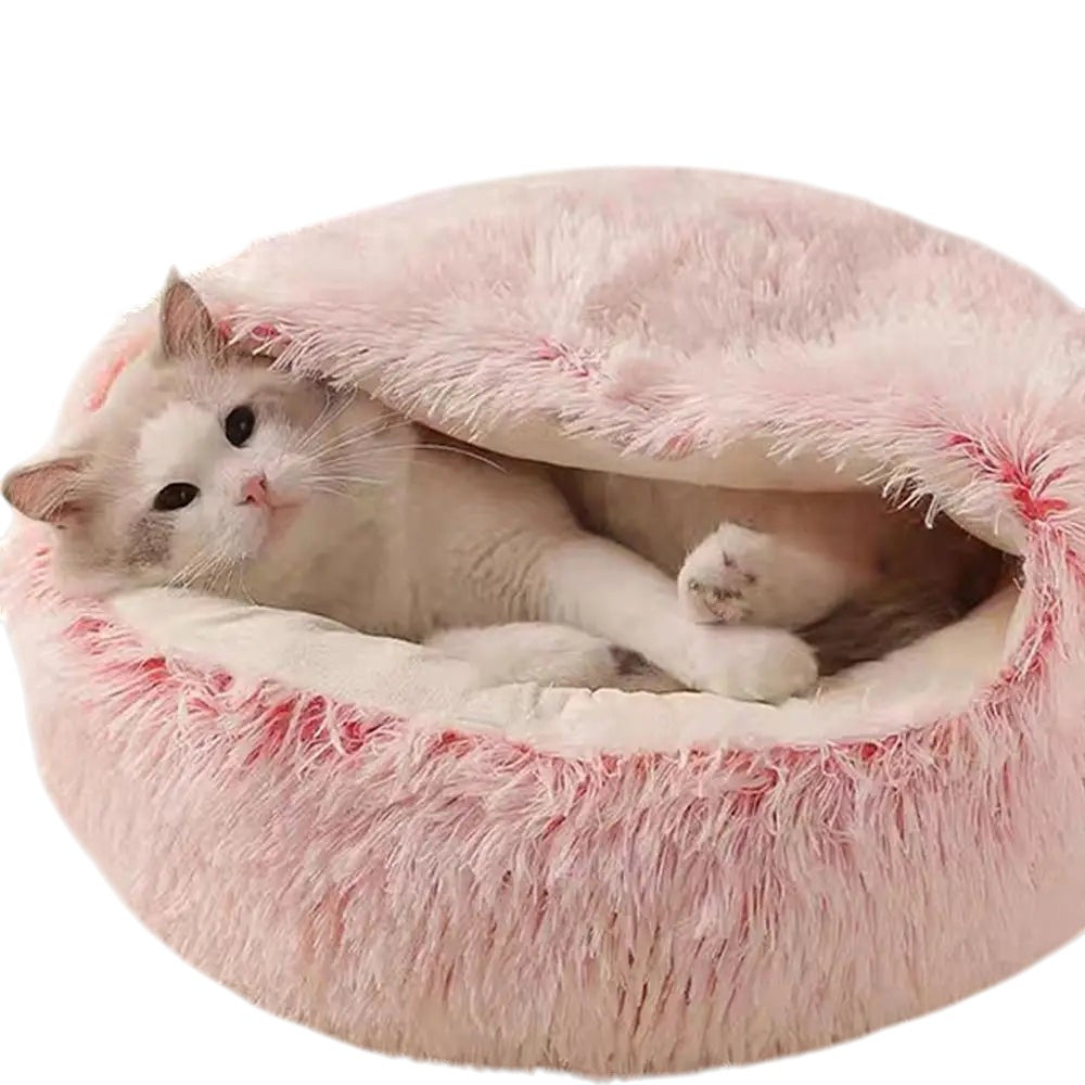 COMFORT pink plush cat bed with draped cover, perfect for burrowing and cozy naps.
