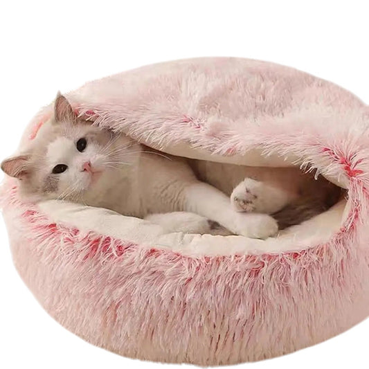 COMFORT pink plush cat bed with draped cover, perfect for burrowing and cozy naps.