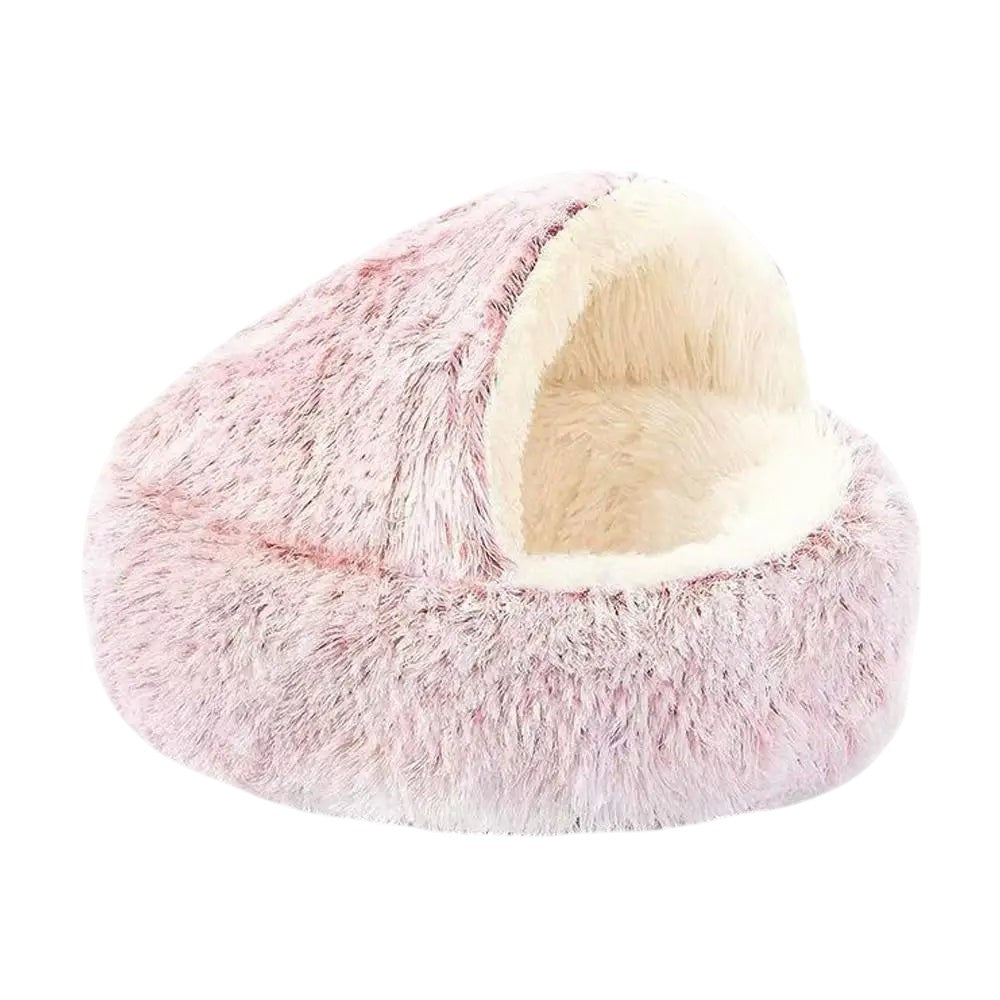 COMFORT plush pink cat bed with cream interior, enclosed burrowing nest design for security and warmth.