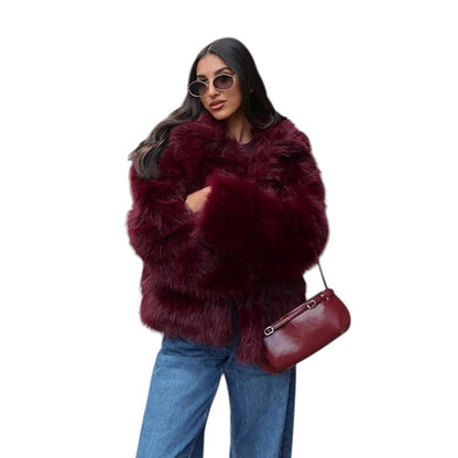 COMFORTH plush faux fur winter jacket in deep red, featuring an oversized collar and relaxed silhouette. Worn by a woman with sunglasses.