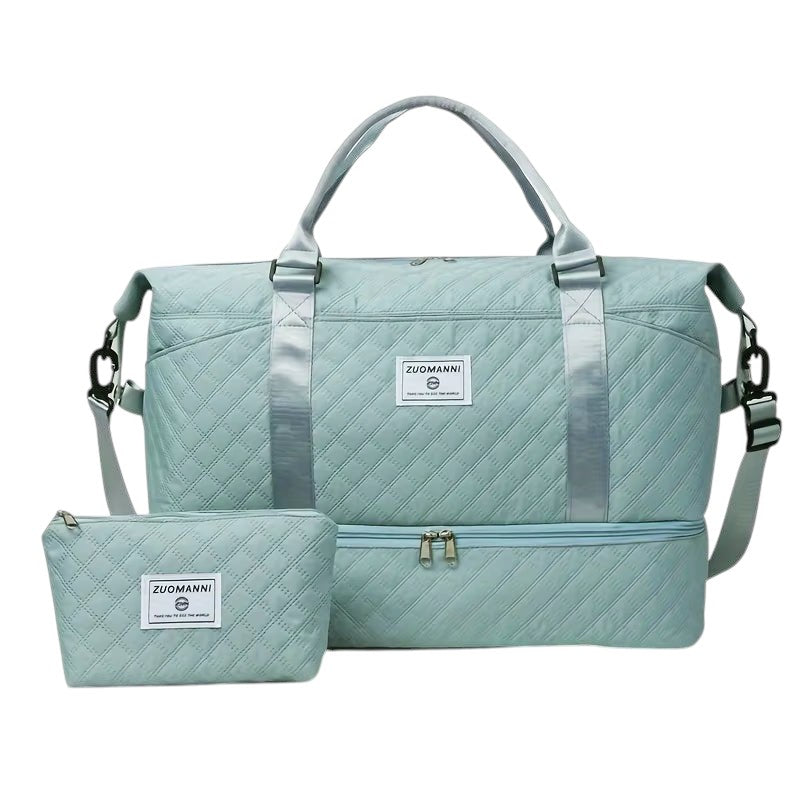 COMFORTH Quilted duffel bag in light blue with matching pouch, featuring diamond quilting and a separate bottom compartment.