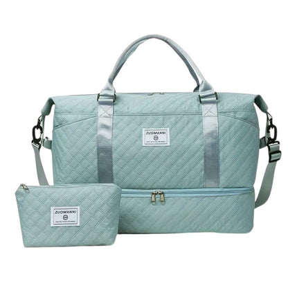 COMFORTH Quilted duffel bag in light blue with matching pouch, featuring diamond quilting and a separate bottom compartment.