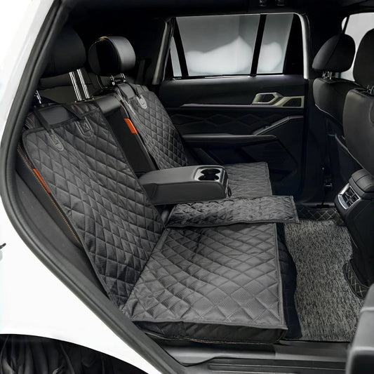 COMFORT quilted black waterproof car seat cover for back seat with orange accents and storage pockets.
