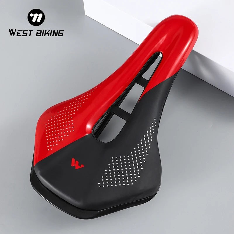 COMFORT red and black ergonomic bicycle saddle with central channel and dot pattern grip
