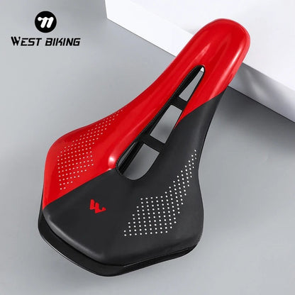 COMFORT red and black ergonomic bicycle saddle with central channel and dot pattern grip