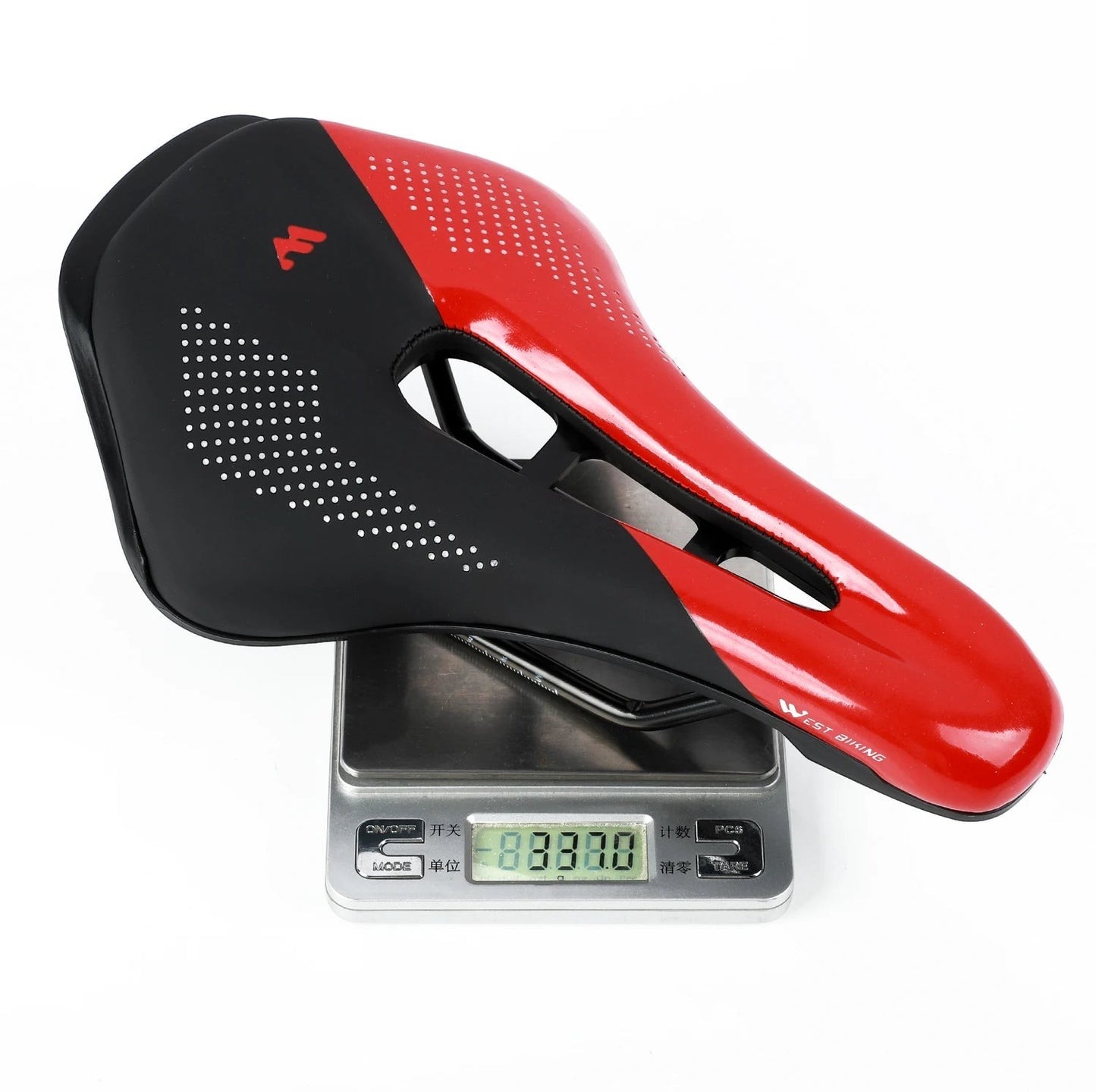 COMFORT red and black ergonomic bicycle saddle with central channel and dot pattern grip. Lightweight and durable.
