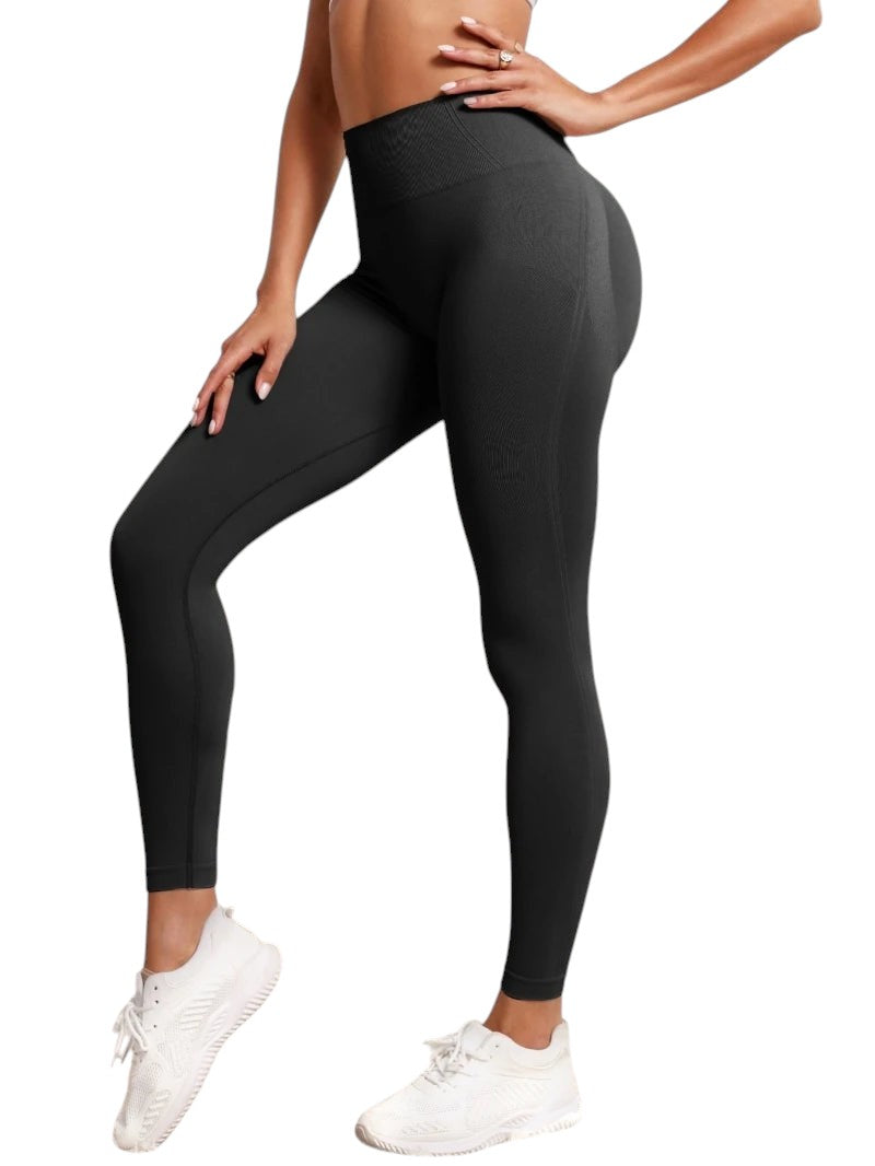 COMFORTHigh-waisted seamless black workout leggings with textured detail and a flattering fit.