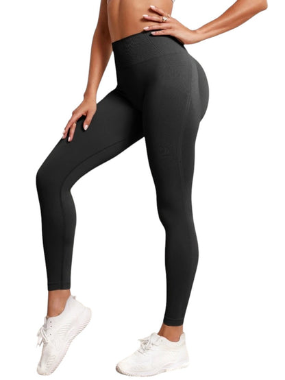 COMFORTHigh-waisted seamless black workout leggings with textured detail and a flattering fit.