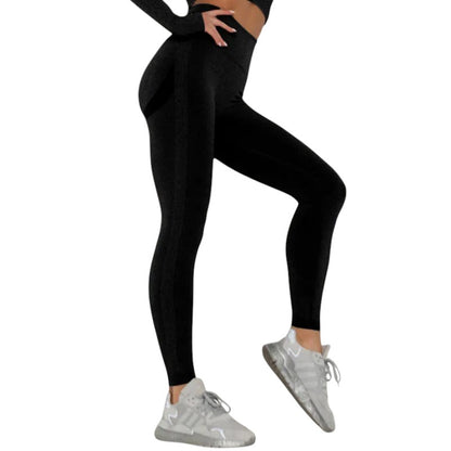 COMFORTHigh waisted seamless black workout leggings with textured detail and ribbed calves. Breathable fabric.