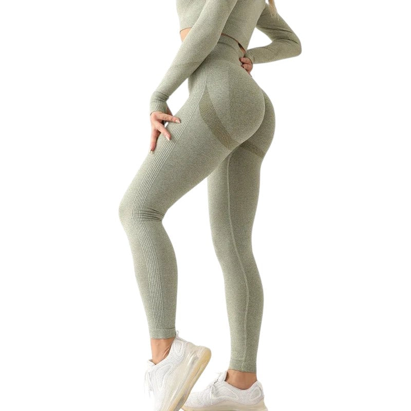 COMFORTH seamless high waisted workout leggings in light green with ribbed calf detail and textured hip accent.