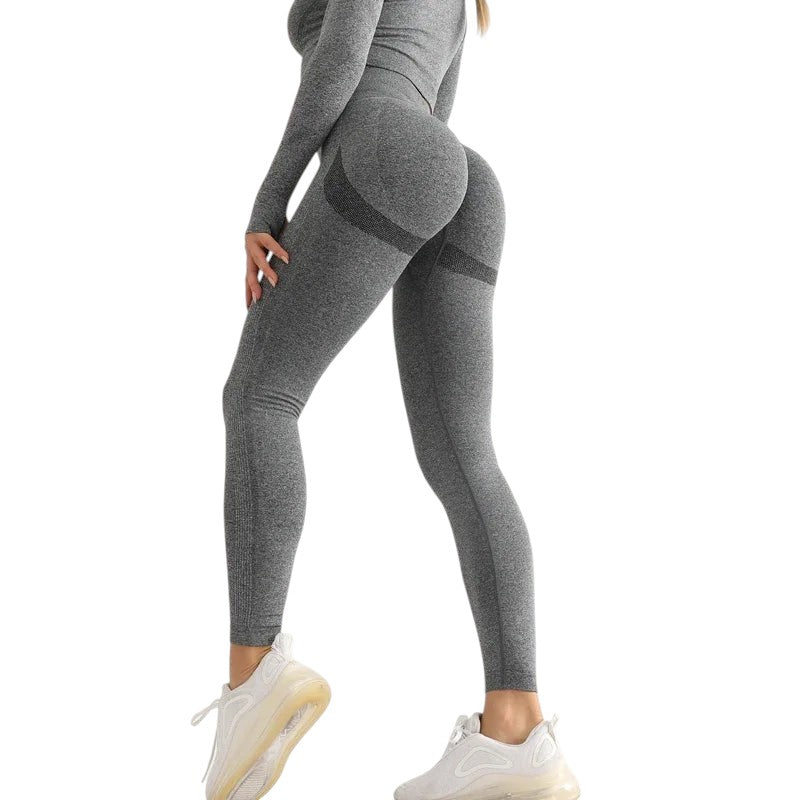 COMFORTHigh-waisted seamless grey workout leggings with textured detail and ribbed calves. Breathable fabric.