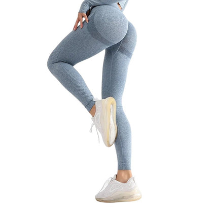 COMFORTH seamless high-waisted light blue workout leggings with textured detail and ribbed calves.