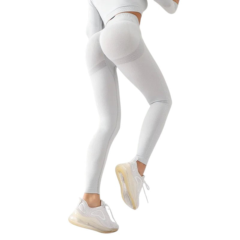 COMFORTHere seamless high-waisted light grey workout leggings with textured detail and ribbed calves.