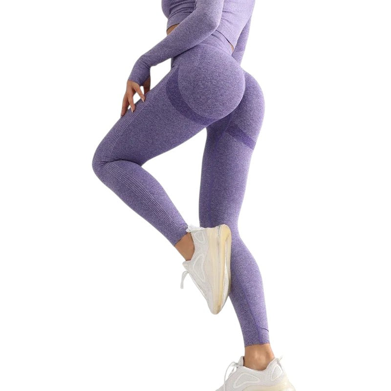 COMFORTHere seamless high-waisted workout leggings in heathered purple with ribbed calf detail and textured buttock enhancement.
