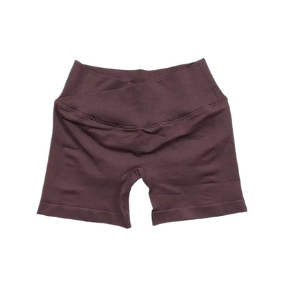 COMFORTH seamless V-waist athletic shorts in mauve, made from a stretchy, breathable fabric. Designed for workouts.