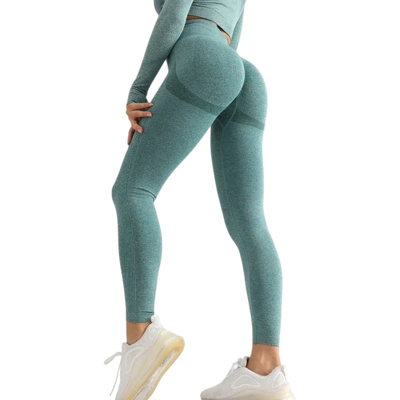 COMFORTHigh waisted seamless teal workout leggings with textured detail and ribbed calves.