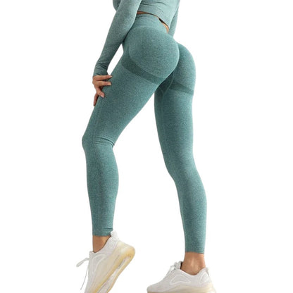 COMFORTHigh waisted seamless teal workout leggings with textured detail and ribbed calves.