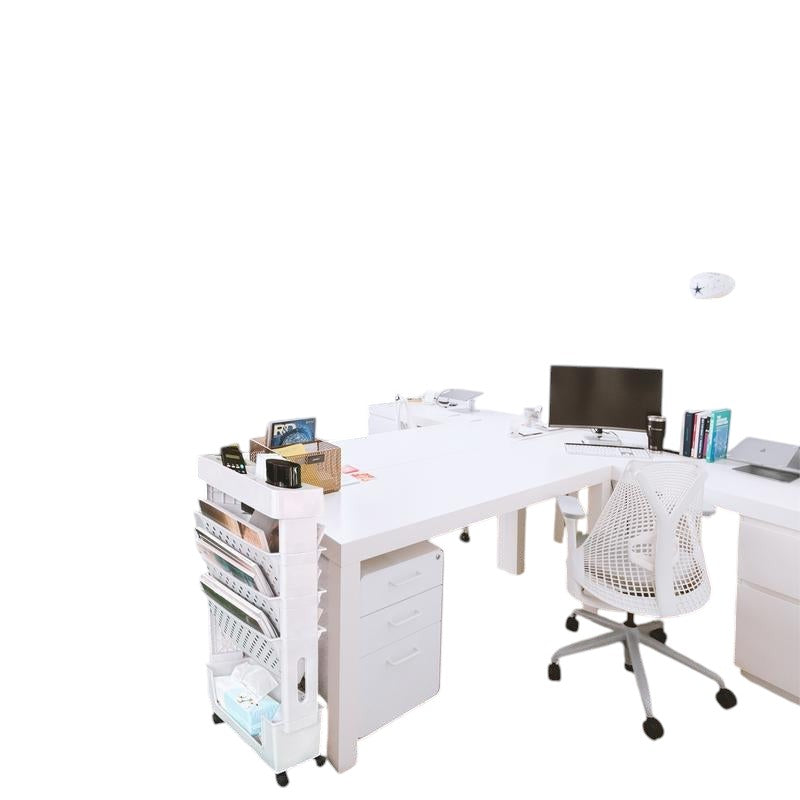 COMFORTH slim white rolling storage cart with multiple shelves holding files, books, and office supplies next to a white desk.