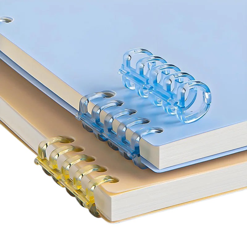 COMFORT spiral bound notebooks in pastel blue and tan with clear plastic binding. Ideal for notes and journaling.