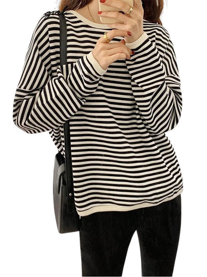 COMFORTH striped long sleeve crew neck knit sweater in black and white, made from soft knit fabric.