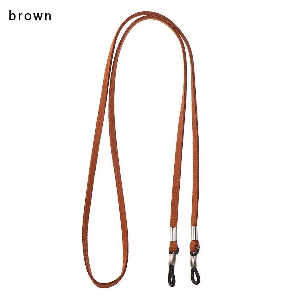 COMFORT brown suede eyeglass chain strap with adjustable silicone loops and metal connectors.