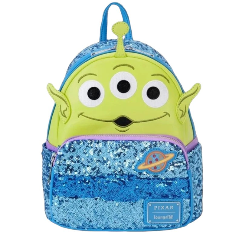 COMFORTH Toy Story Alien backpack with green face, three eyes, blue sequin front pocket, and Pizza Planet logo.