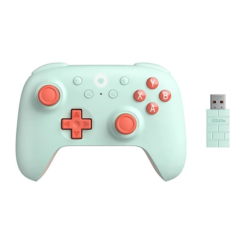 COMFORTH Ultimate 2C Wireless Gaming Controller in pastel mint with coral pink buttons and joysticks. Includes USB receiver.