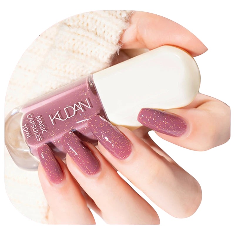 COMFORTH water-based peel-off nail polish in dusty rose with gold glitter flecks. 10ml bottle.
