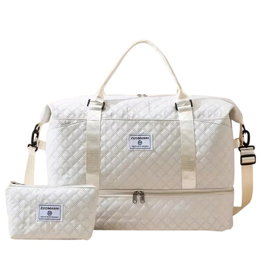 COMFORTH white quilted duffel bag with matching pouch, featuring diamond quilting and a separate bottom compartment.