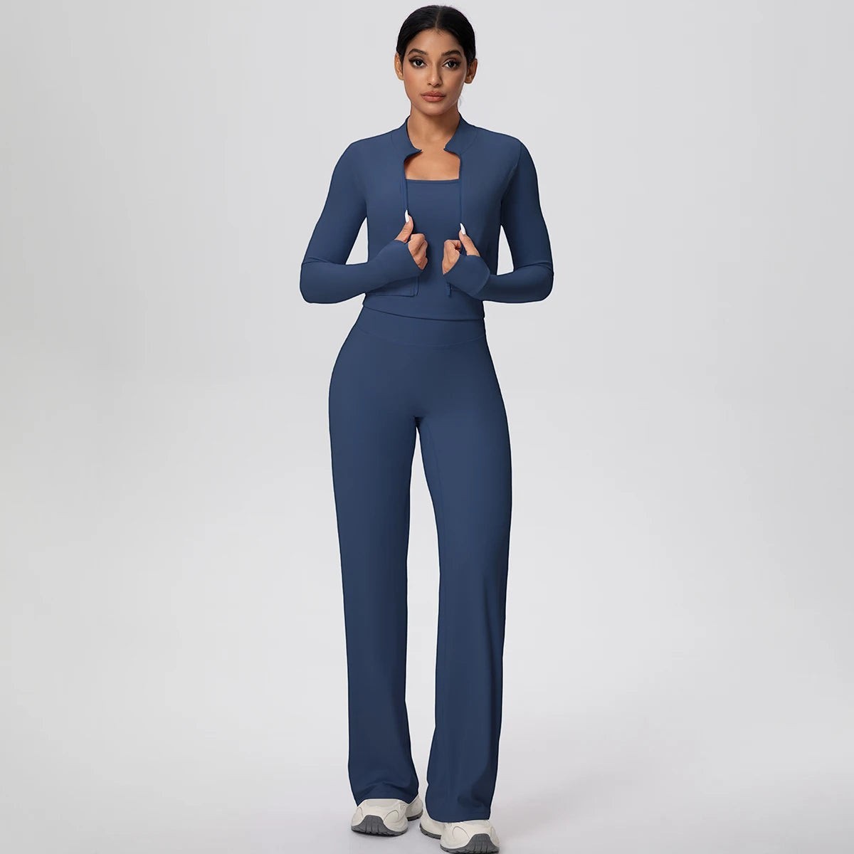 COMFORT Women's navy blue three-piece athletic set with cropped jacket, sports bra, and wide-leg pants.