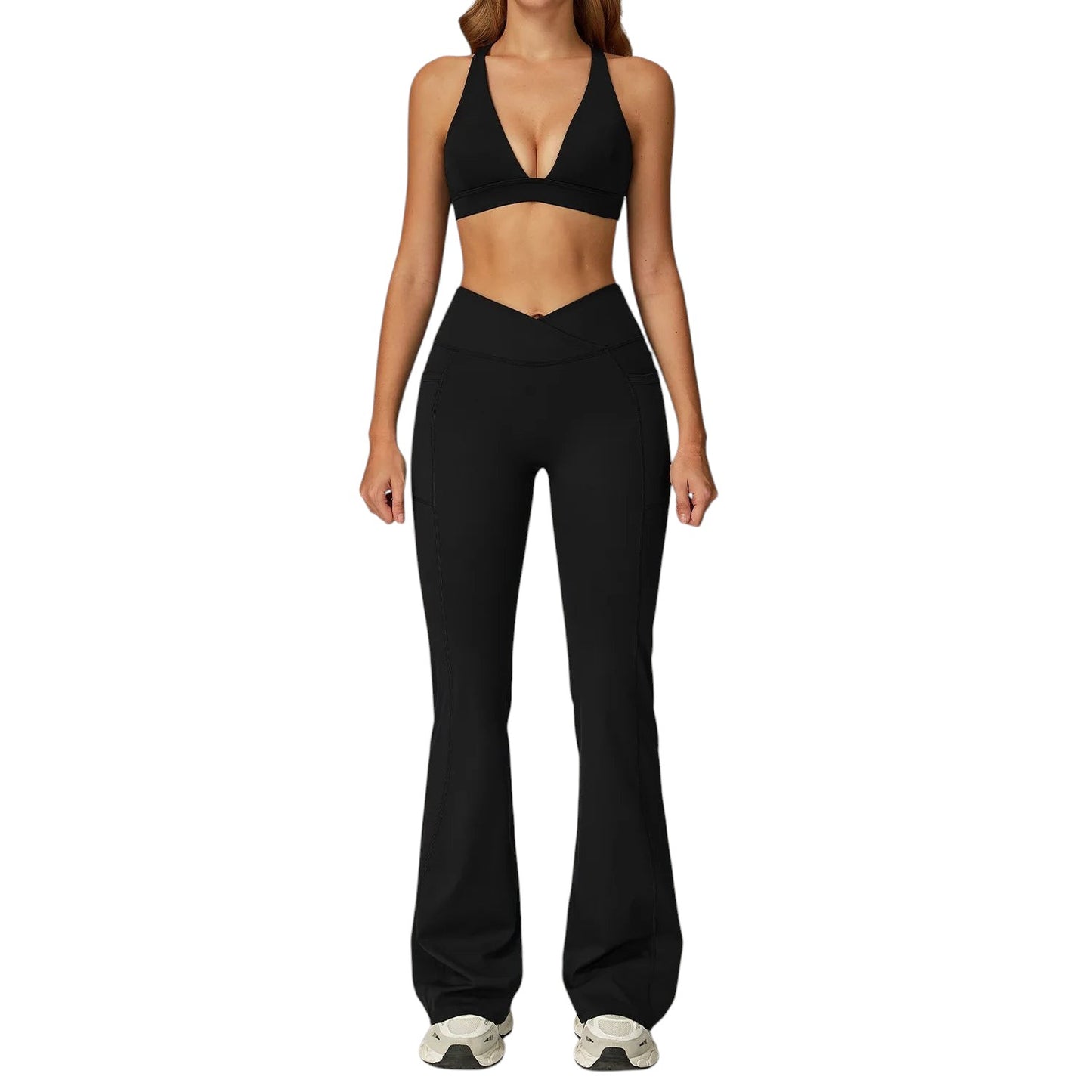 COMFORTH Women's black athletic two-piece set with halter neck sports bra and V-waist flare leggings. Stretchy fabric.