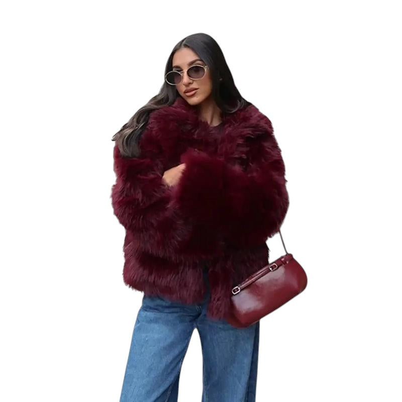 COMFORTH women's plush faux fur jacket in deep red, featuring an oversized collar and relaxed fit. Model wears jeans and sunglasses.