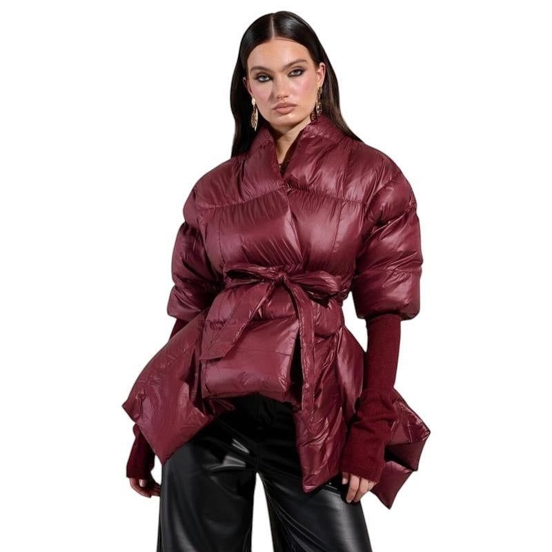 COMFORT women's burgundy puffer jacket with belt, voluminous sleeves, and tie waist. Made from lustrous puffer material.