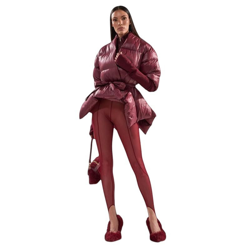 COMFORT Women's burgundy puffer jacket with tie-waist belt, voluminous sleeves, and high collar.