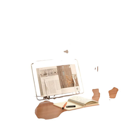 COMFORTH clear acrylic book stand holding an open book, with a notebook and pen beside it. Adjustable for hands-free reading.