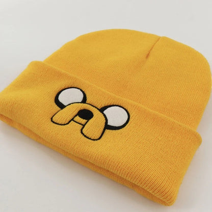 COMFORTH Adventure Time Jake the Dog yellow knit beanie with embroidered face and floppy ears.