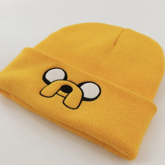 COMFORTH Adventure Time Jake the Dog yellow knit beanie with embroidered face and floppy ears.