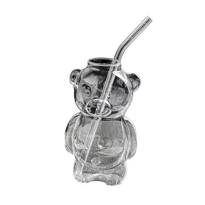 COMFORTH Adorable clear glass bear-shaped drinking glass with a reusable glass straw, perfect for beverages.