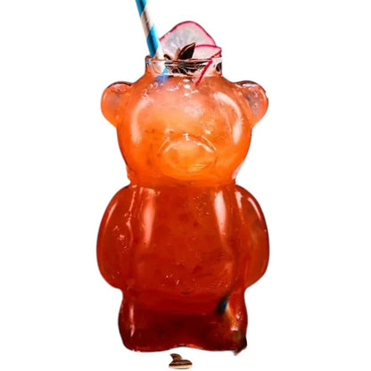 COMFORTH Adorable bear-shaped glass with a red beverage and blue striped straw. Features detailed bear ears and face.