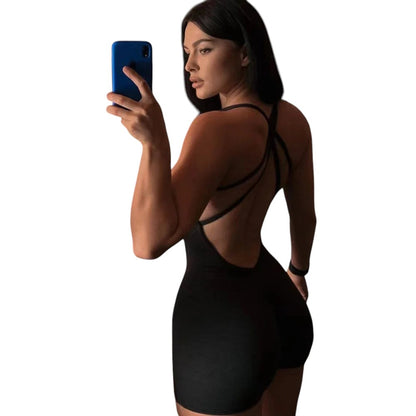 COMFORTH black athletic bodysuit with open back and crisscross straps, made from breathable fabric.